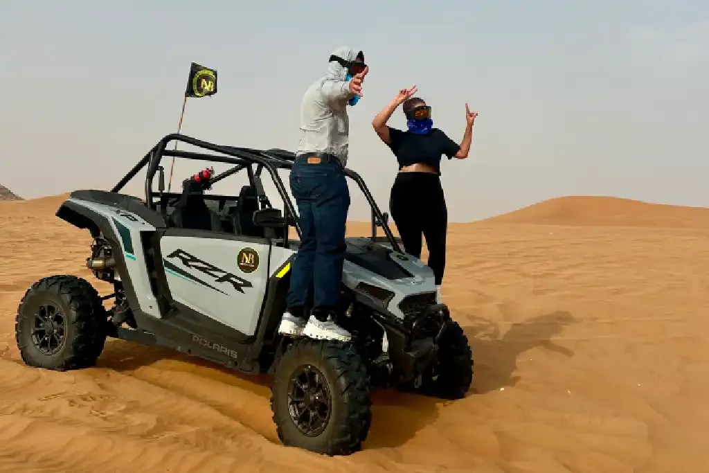 Polaris RZR Dubai 1 Polaris RZR dune buggy driving in the Dubai desert